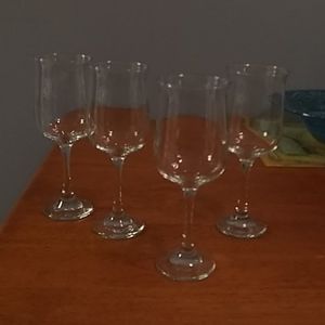 Set of 4 tall crystal wine glasses.
